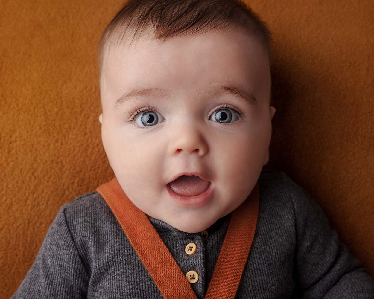 Baby photographed during 100 day milestone photography session in Auckland studio